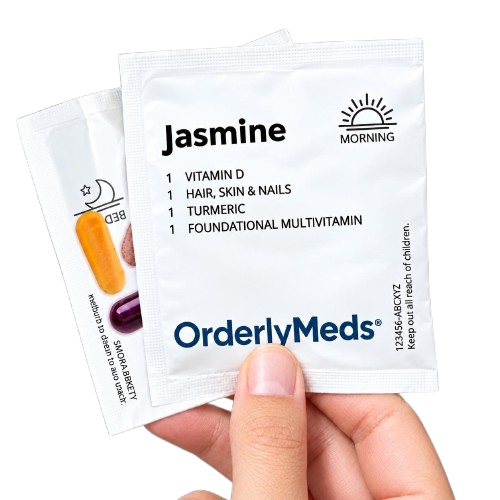Hands sorting daily supplement packs