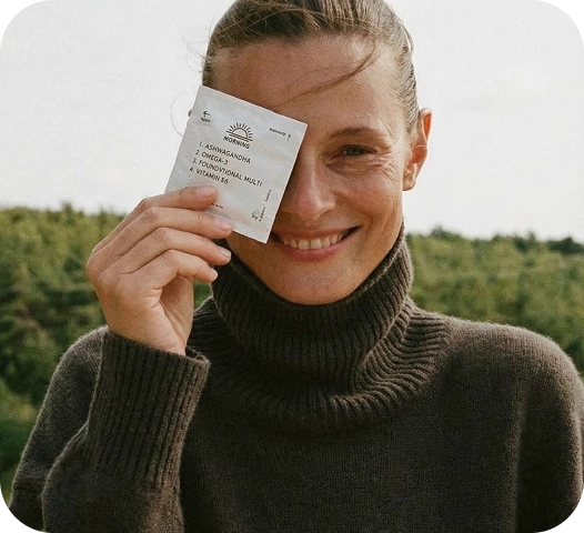 A girl smiling and holding persona packs