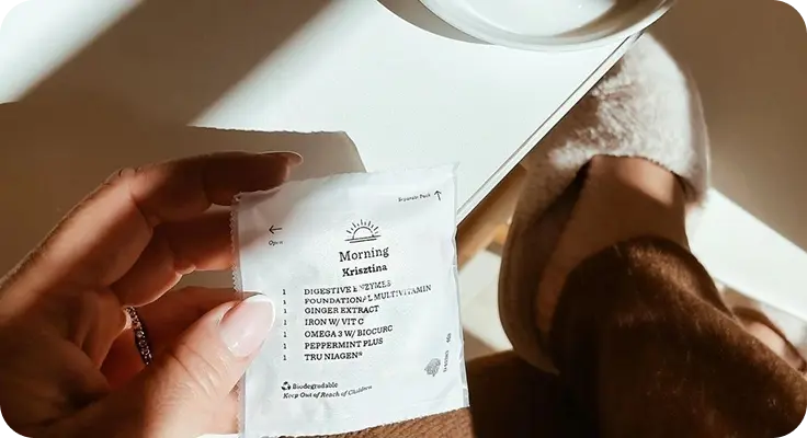 Personalized supplement pack held in hand
